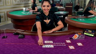 Asian lady dealing Andar Bahar