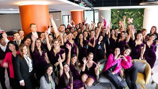 photos of a large group of happy eeze employees